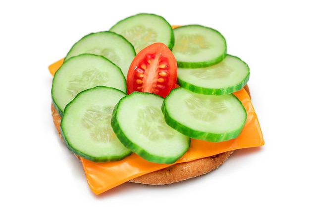 Cracker sandwich with fresh cucumber tomato cherry and cheese isolated