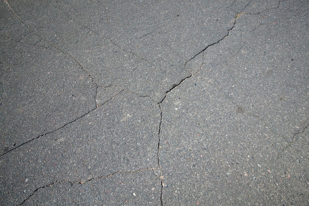 Cracks on the paved highway close up