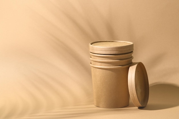 Craft paper soup cup on brown background Empty container for take away food Ecological individual package Zero Waste