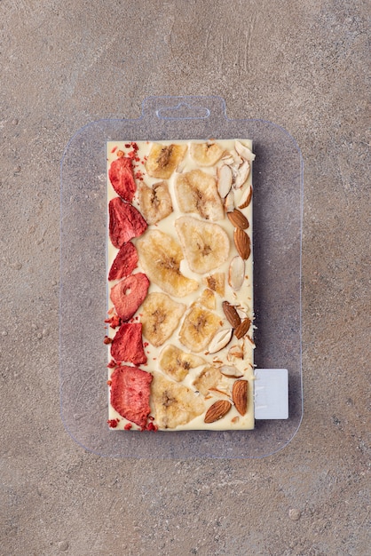 Craft white chocolate with freeze-dried strawberries and almonds