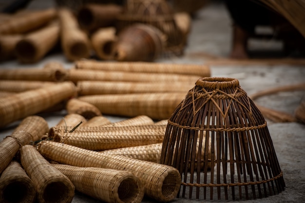 Craftsman making bamboo fish trap at old village, Hung Yen, Vietnam