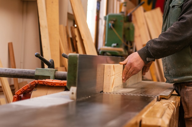 Craftsman working in his workspace. Joiner work in carpentry. 