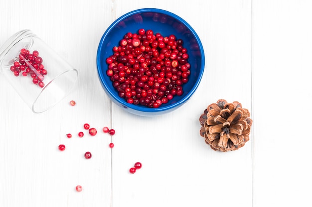 Cranberries in a bowl on white table