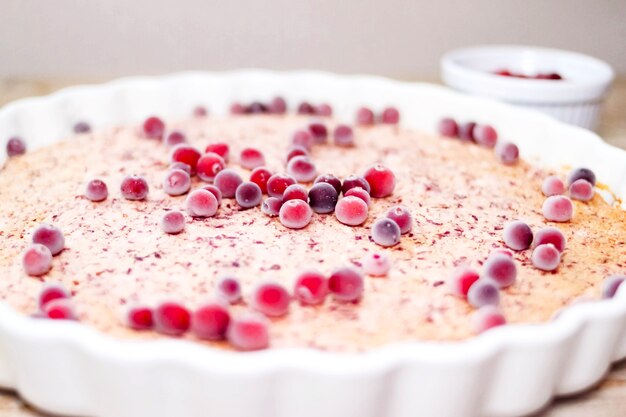 Cranberry cake on white baking dish