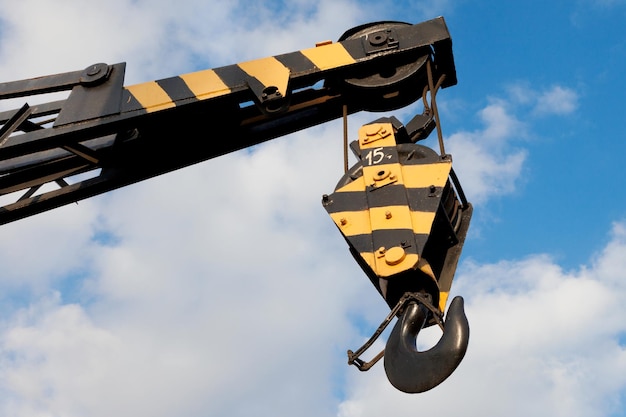 Crane hook on a blue sky