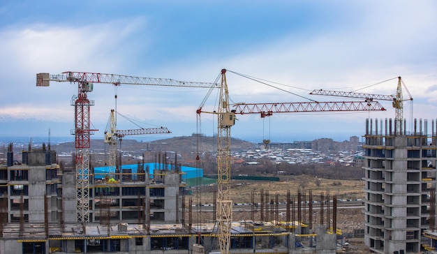 Cranes and building with blue sky