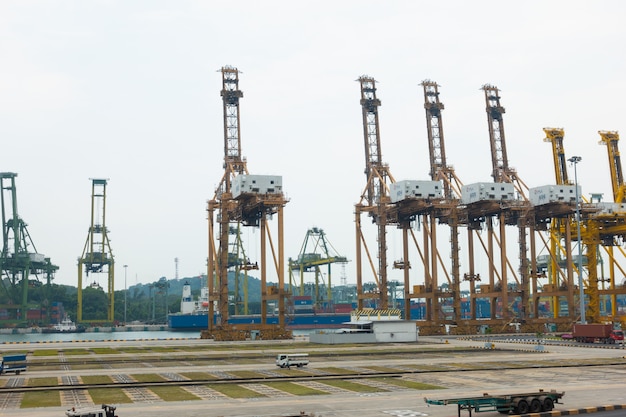 Cranes cargo shipping in Singapore city.