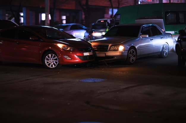 Crashed cars in street at nightxA