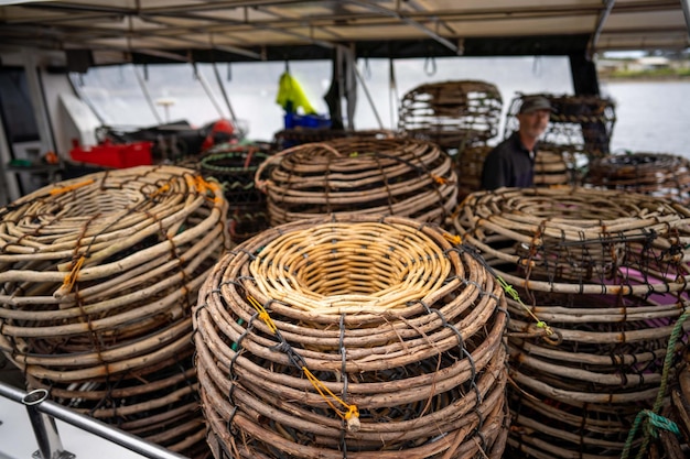 Crayfish cray pots on the back of a fishing boat in tasmania australia