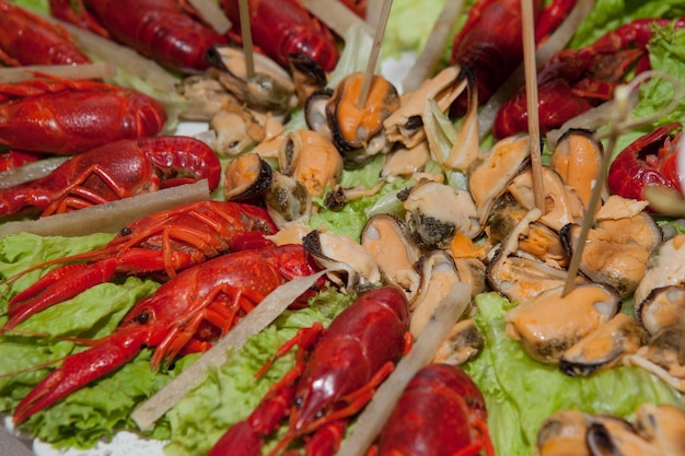 Crayfish and mussels as appetizers for beer on a snack table