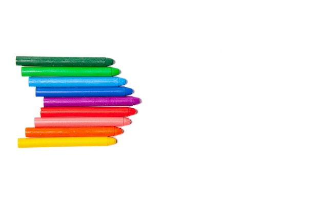 Crayons lined up in rainbow isolated on white background