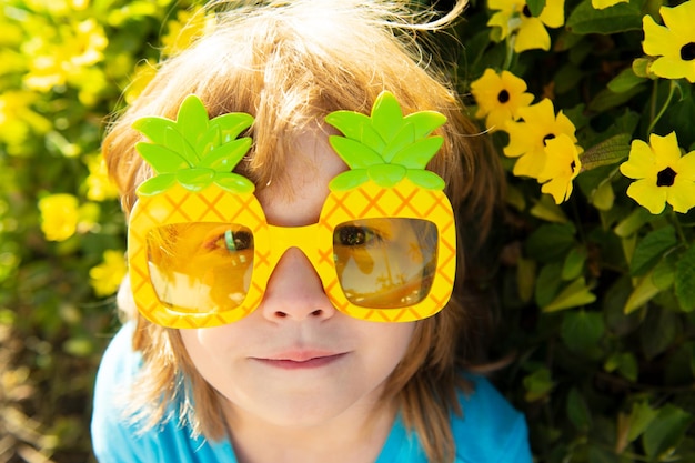 Crazy summer vibes Cute child in party sunglasses