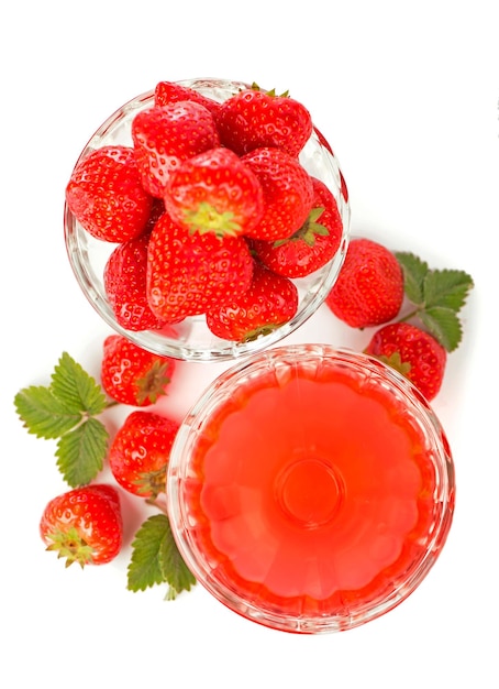 Cream bowl bowl with fresh strawberries and sweet strawberry jelly against white background