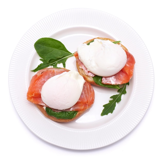 Cream cheese Smoked salmon and poached egg toasts on a plate