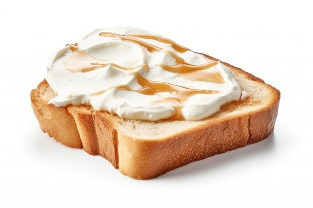 Cream cheese spread on white bread pictured on a white background