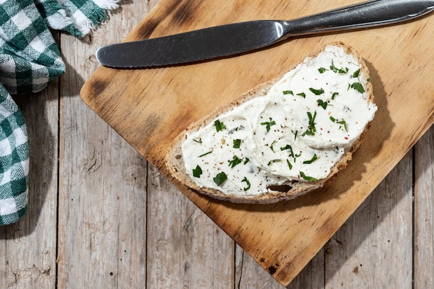 Cream cheese toast on cutting board