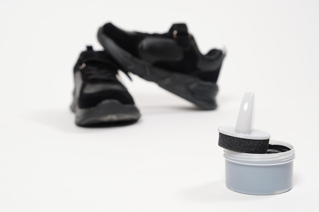 Cream paint for shoes and black children's sneakers