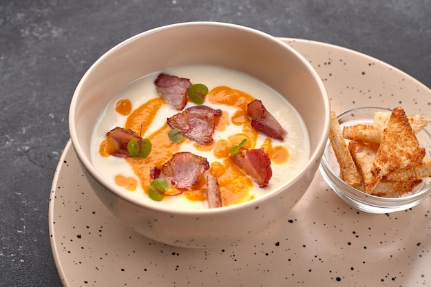 Cream soup cauliflower with bacon and croutons