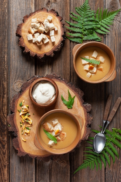 Cream soup from fresh forest  mushrooms chanterelles with croutons. 