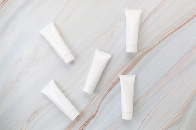 cream tube skincare package on background marble