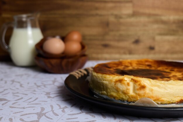 Creamy cheesecake on brown and white background