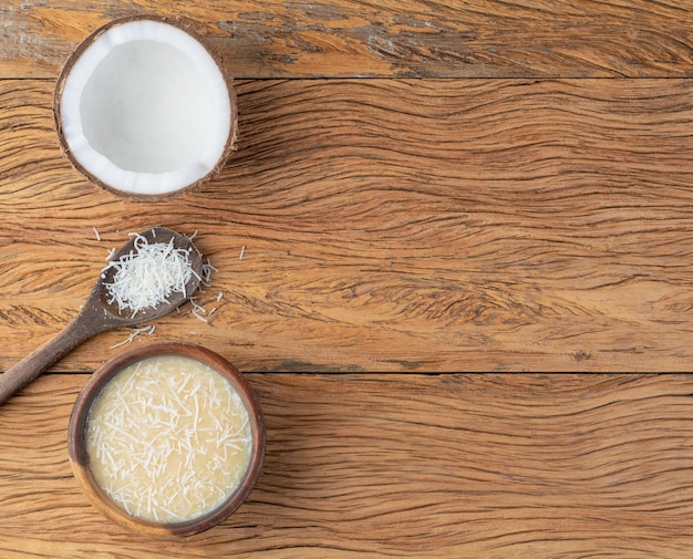 Creamy cocada traditional brazilian coconut candy with grated coconut and copy space