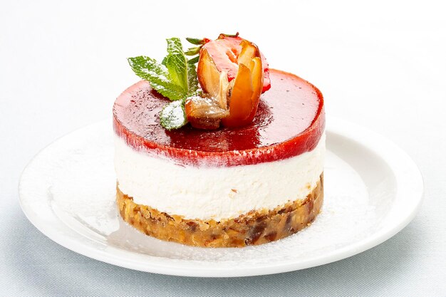 Creamy dessert with strawberry jelly and biscuit On white background