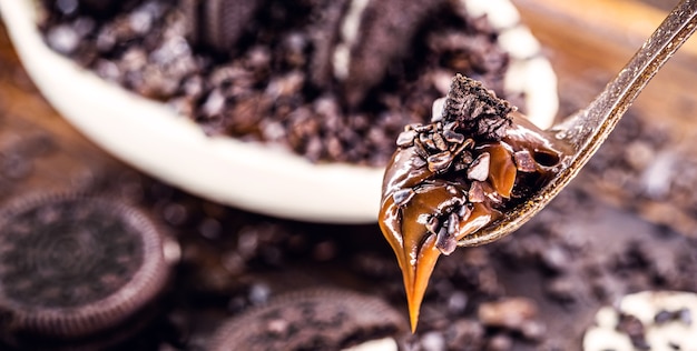 creamy filling of white and black Easter egg chocolate. Typical Brazilian tradition, Easter dessert. Selective focus.