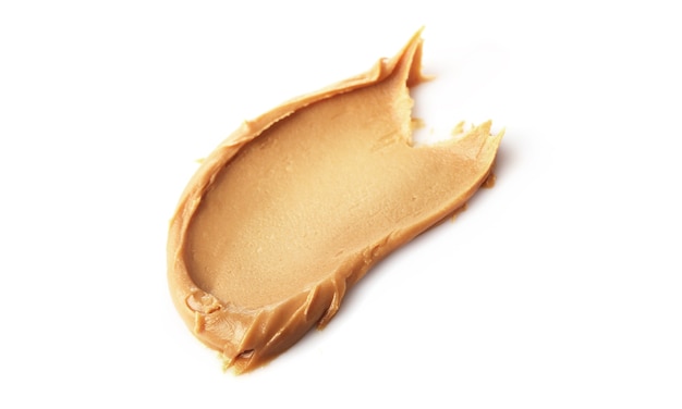 Creamy peanut butter isolated on white