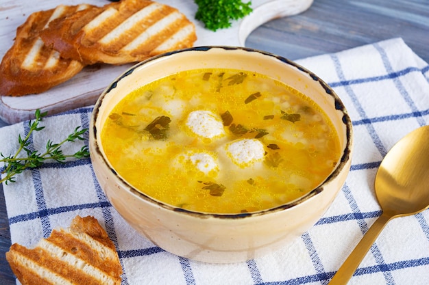 Creamy soup with chicken meatballs Meatball soup in bowl