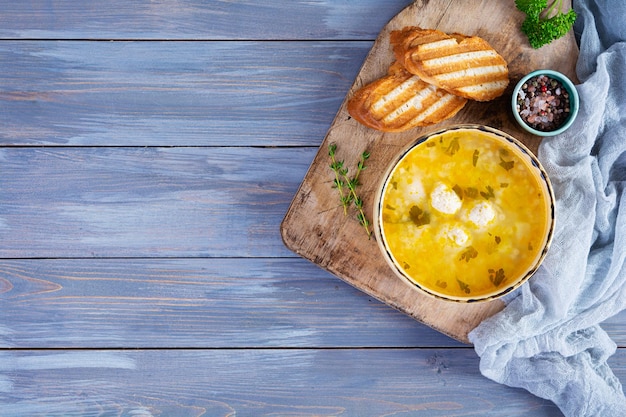 Creamy soup with chicken meatballs Meatball soup in bowl