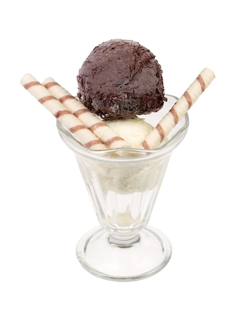 Creamy sundae ice cream in cup with wafer rolls on white background