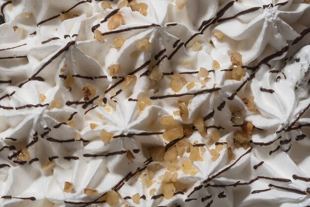 Creamy whipped cream topping with chocolate sprinkles.