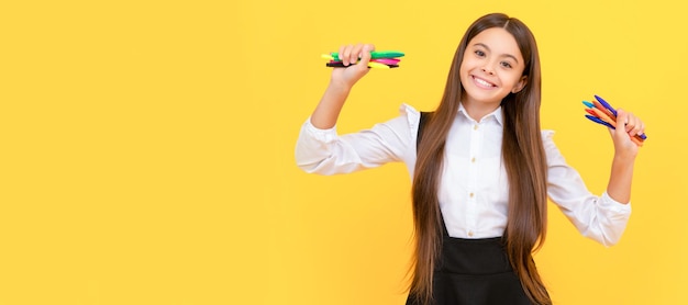 Create a difference Happy kid hold felttip pens Creative education Creative skills Banner of schoolgirl student School child pupil portrait with copy space