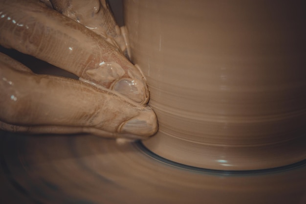 Creating ceramic products of white clay closeup