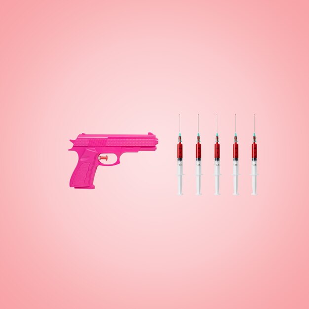 Creative backdrop made with pink handgun and syringes