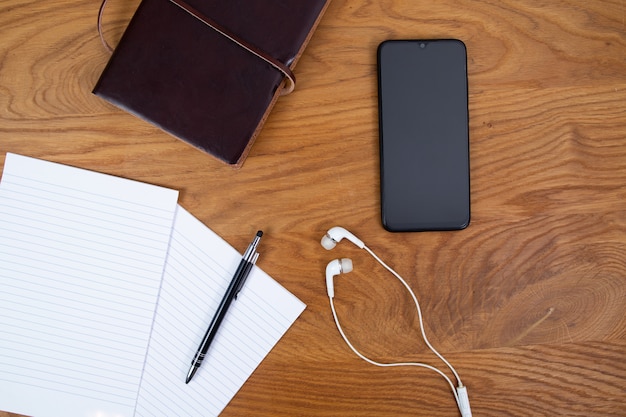 Creative background flat lay, writing, notes phone