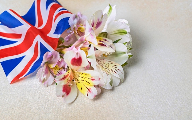 Creative british style background with flowers and united kingdom uk flag