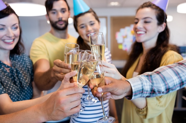 Creative business team having a toast on colleges birthday Creative business team having a toast on