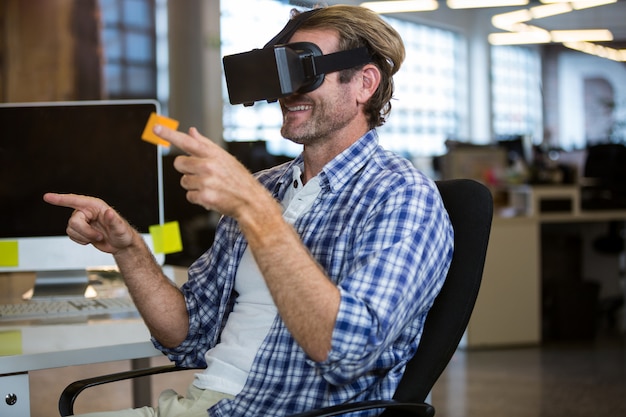 Creative businessman using virtual reality simulator