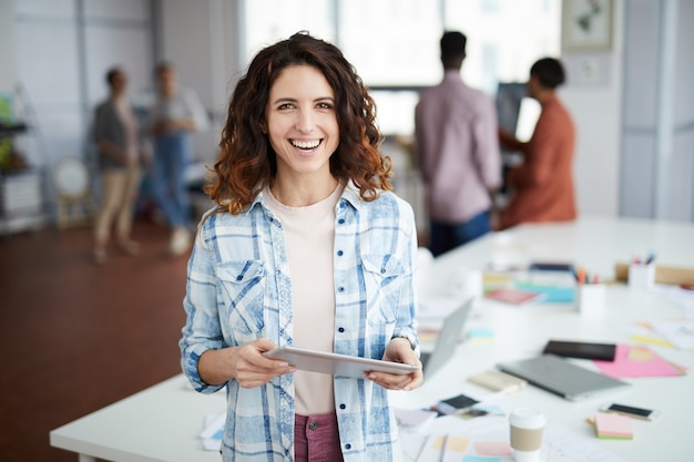 Creative Businesswoman Smiling at Camera