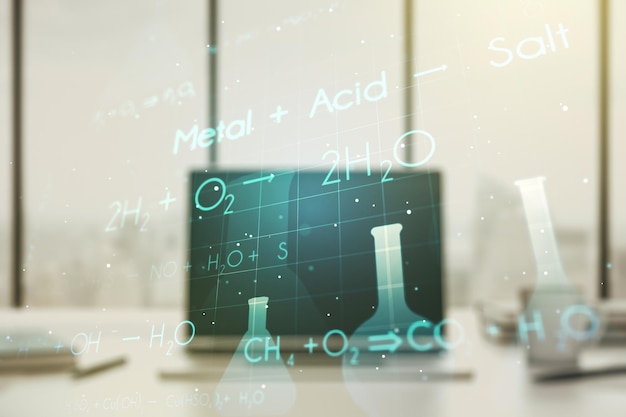 Creative chemistry hologram on modern laptop background pharmaceutical research concept Multiexposure