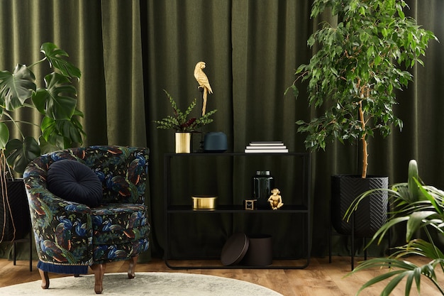 Creative composition of living room interior design with designed armchair, black geometric console, plants and golden accessoriers. Urban jungle concpet. Template.