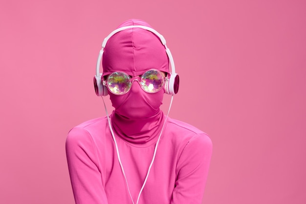 Creative crazy pink photo on a pink background with pink clothes and accessories cyberpunk concept and conceptual art photography