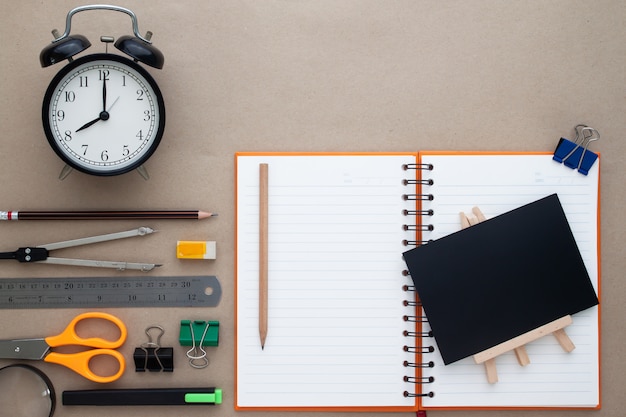 Creative flat lay of back to school concept with stationary on workspace desk