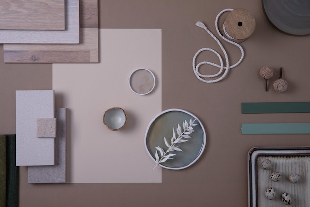 Creative flat lay composition of interior designer moodboard with textile and paint samples panels