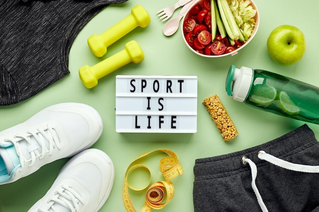 Creative flat lay of sport and fitness equipments