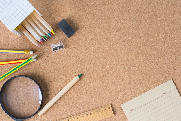 Creative flat school desk with note paper and pencils and space for your text