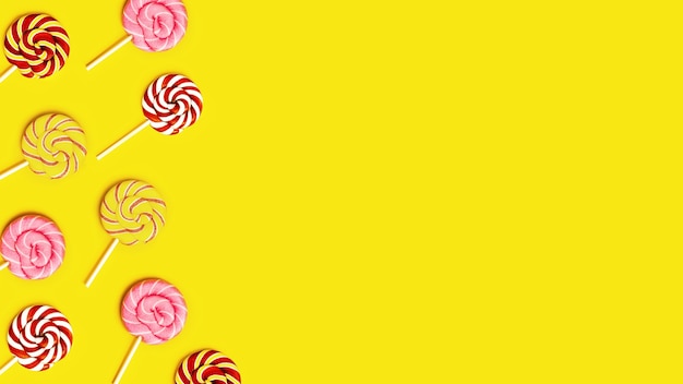 Creative frame with with sweet round candy lollypops with stripes on stick on yellow