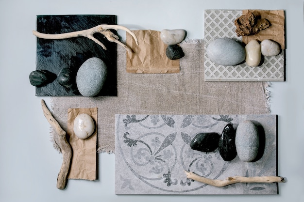 Creative layout abstract geometry squares by nature materials paper, textile, ceramics with stones and dry branches. Flat lay. Space for any products. 